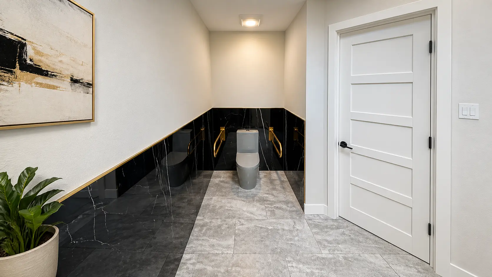 Half-bathroom remodel — black marble with brass accents