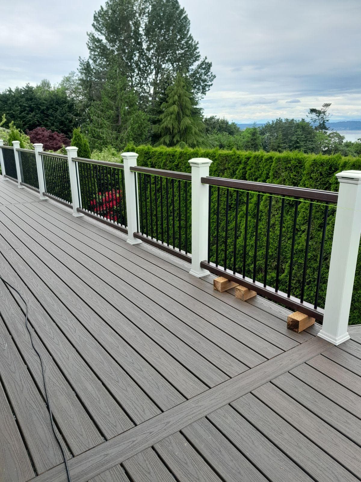 Decking — grey composite deck overlooking landscape